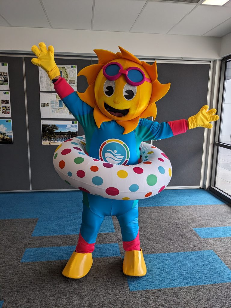 New mascot Sunny in an excited pose